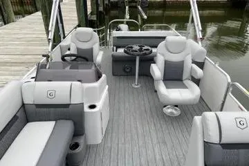 Slide: The Image of 2020 Sweetwater 2286 SFL pontoon boat interior with gray seating and steering console. - 11