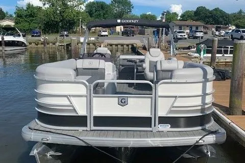 Slide: The Image of 2020 Sweetwater 2286 SFL pontoon boat docked at a marina. - 5