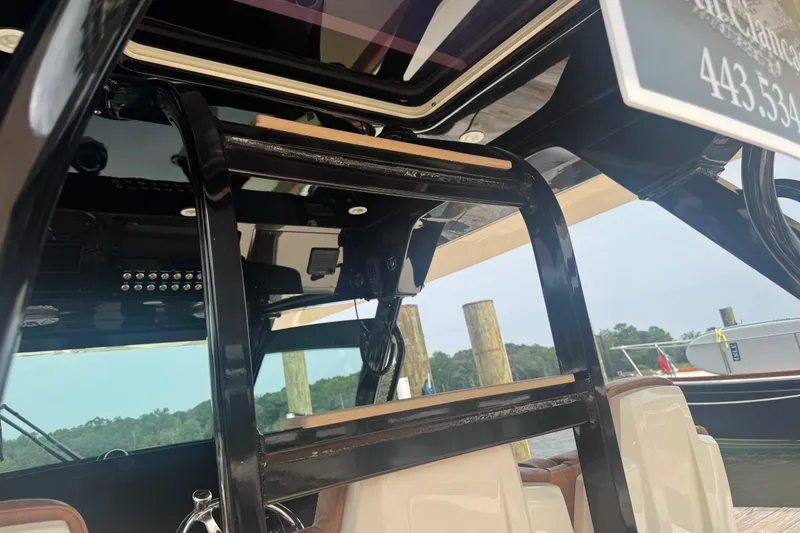 Slide: The Image of 2023 Scout 400 LXF boat interior with sleek black framework and modern design elements. - 19