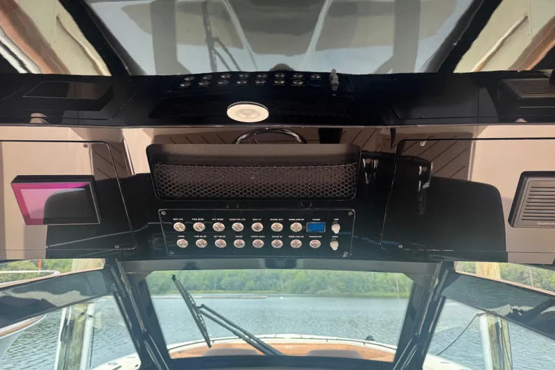 Slide: The Image of 2023 Scout 400 LXF boat dashboard with advanced controls and navigation system. - 20