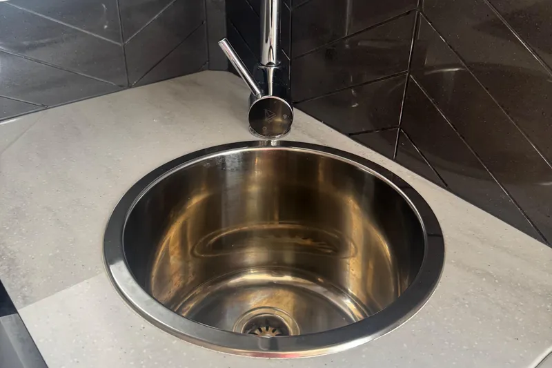Slide: The Image of Stainless steel sink with modern faucet on Scout 400 LXF, 2023 model. - 30