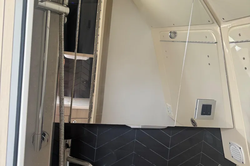 Slide: The Image of 2023 Scout 400 LXF interior shower with modern fixtures and sleek design. - 33