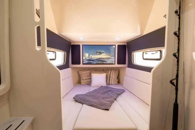 Slide: The Image of Manufacturer Provided Image: Luxurious cabin interior of 2023 Scout 400 LXF boat with cozy bedding and modern design. - 41