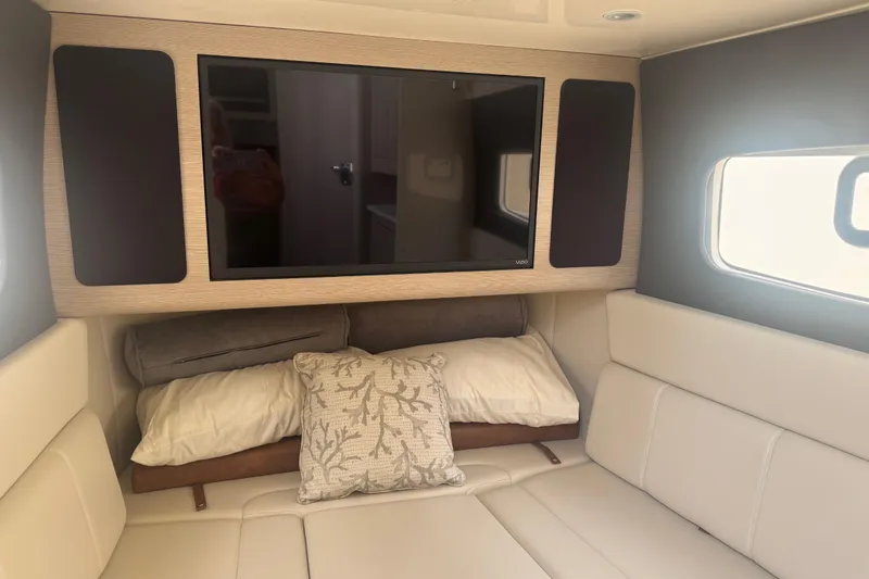Slide: The Image of Interior of 2023 Scout 400 LXF boat with TV and comfortable seating. - 43