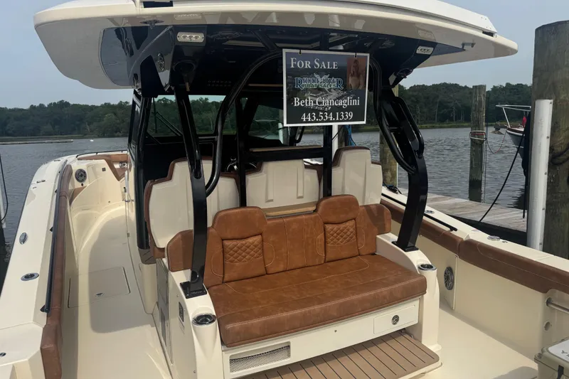 Slide: The Image of 2023 Scout 400 LXF boat for sale, featuring luxurious seating and modern design. - 7