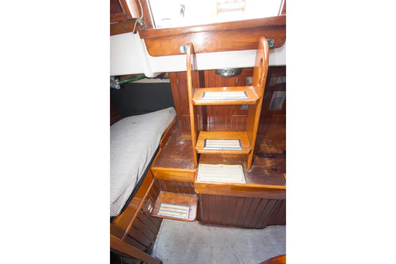 Slide: The Image of Wooden interior stairs of a 1965 Pearson Vanguard sailboat cabin. - 11