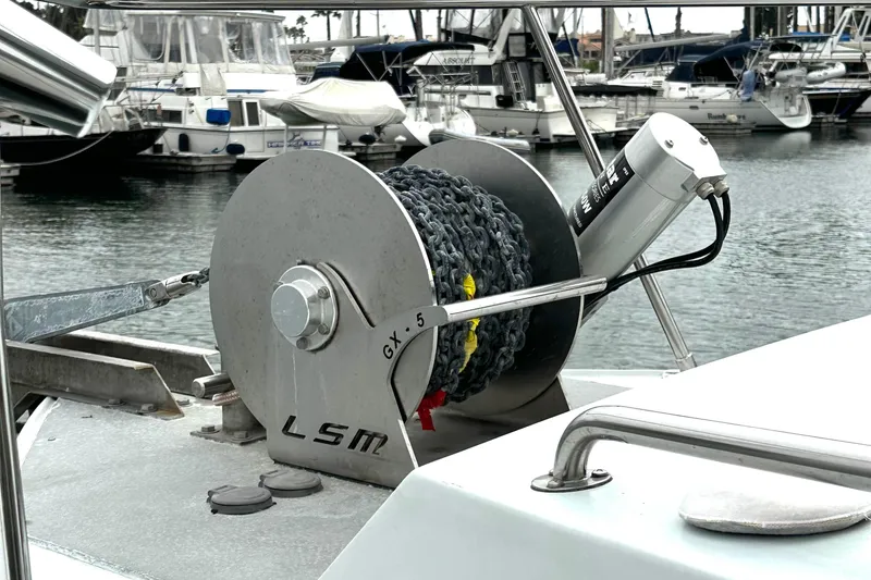 Slide: The Image of Boat anchor winch on a Custom NUWAVE 36, 1990, docked at marina. - 16