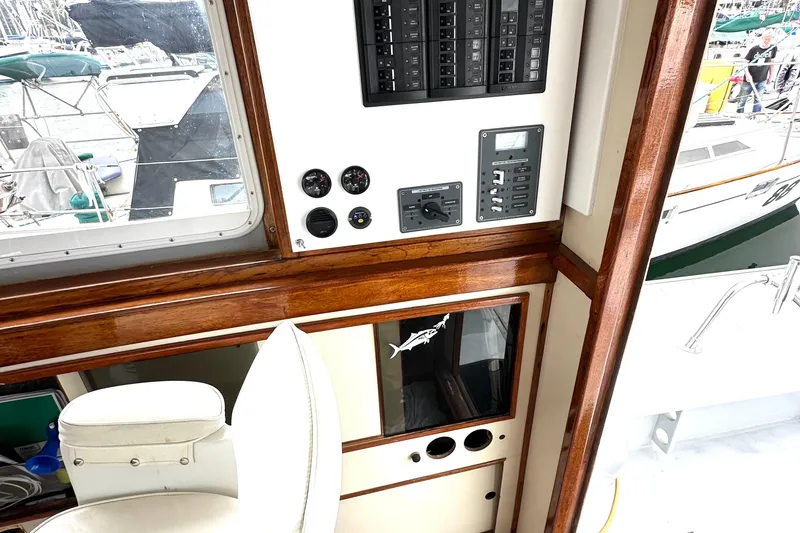 Slide: The Image of Interior of 1990 Custom NUWAVE 36 boat with control panel and gauges. - 21