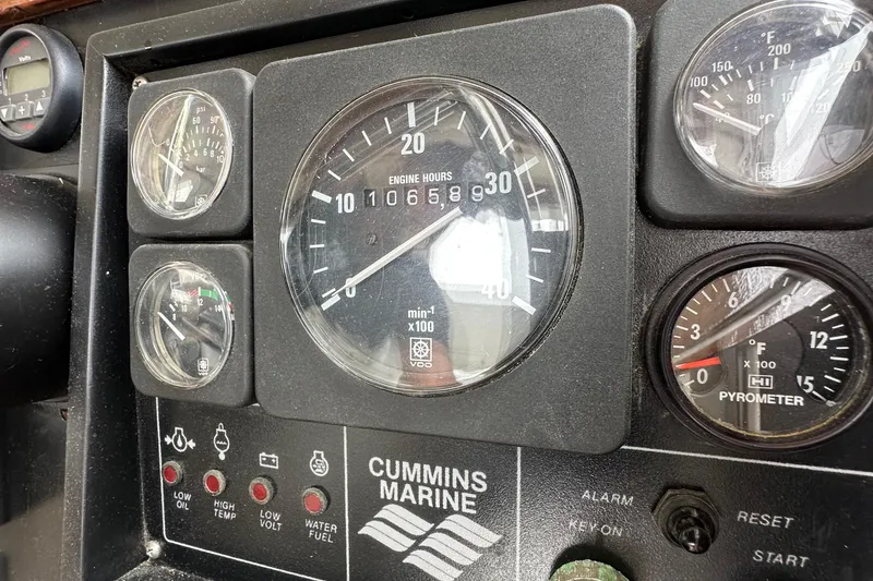 Slide: The Image of Instrument panel of a 1990 Custom NUWAVE 36 with Cummins Marine gauges. - 23