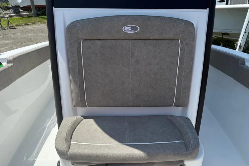 Slide: The Image of 2026 Sea Hunt Ultra 265 SE boat seat with gray upholstery and logo. - 10