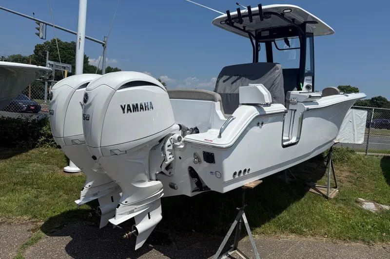Slide: The Image of 2026 Sea Hunt Ultra 265 SE boat with twin Yamaha engines on display. - 3