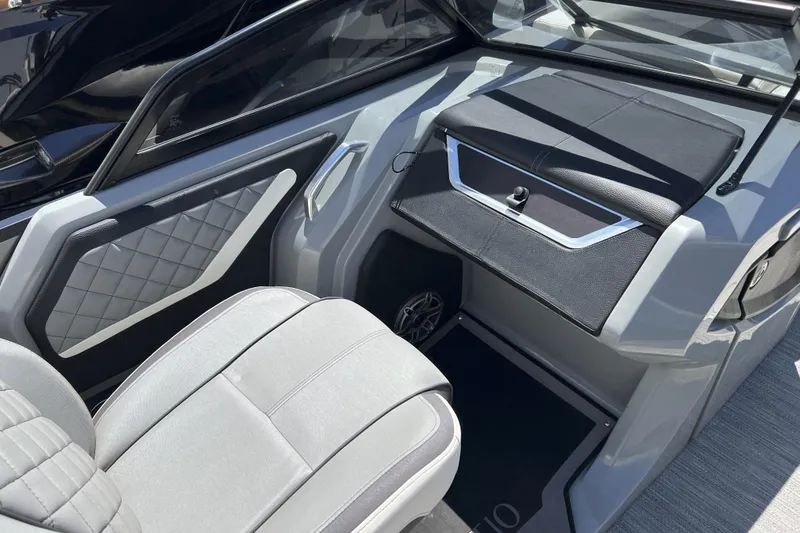 Slide: The Image of Interior of 2022 Godfrey AquaPatio 255 SBW boat with sleek seating and modern design. - 8