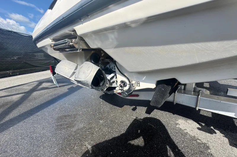 Slide: The Image of Rear view of a 2018 Scarab 195 G boat on a trailer, showing the jet propulsion system. - 10