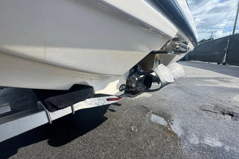 Slide: The Image of 2018 Scarab 195 G boat on trailer, showing hull and propulsion system. - 11