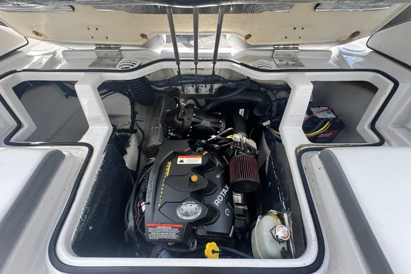 Slide: The Image of Engine compartment of a 2018 Scarab 195 G boat, featuring a Rotax engine. - 19