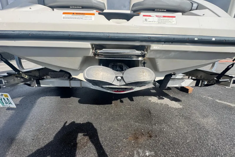 Slide: The Image of Rear view of a 2018 Scarab 195 G boat on a trailer. - 9