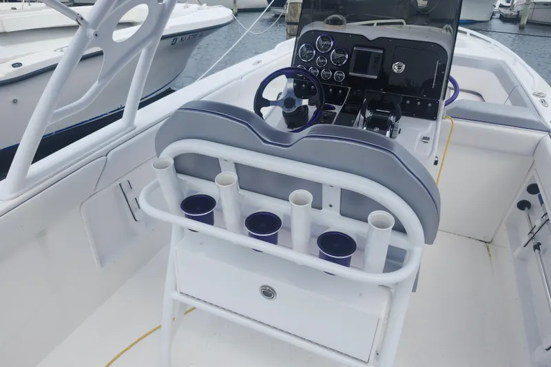 Slide: The Image of 2014 Concept 30 Cuddy boat interior with steering console and rod holders. - 11