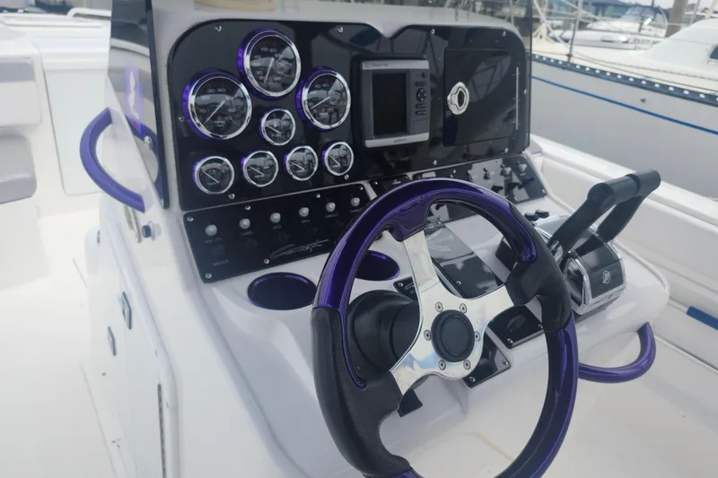 Slide: The Image of Steering console of 2014 Concept 30 Cuddy boat with gauges and controls. - 13