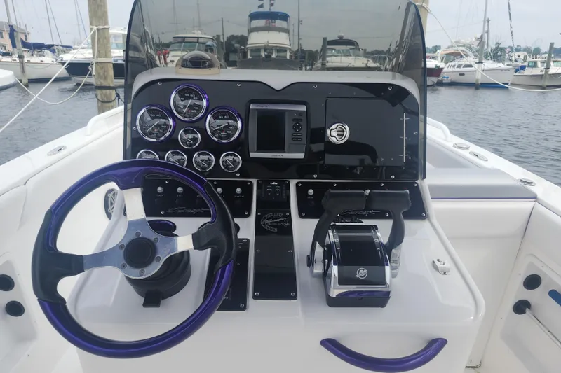 Slide: The Image of Cockpit of 2014 Concept 30 Cuddy boat with steering wheel and control panel. - 14