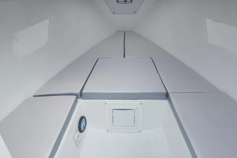 Slide: The Image of 2014 Concept 30 Cuddy cabin interior with cushioned seating and storage compartment. - 25