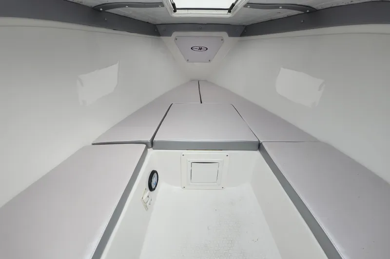 Slide: The Image of Interior of 2014 Concept 30 Cuddy boat, featuring cushioned seating and sleek design. - 26