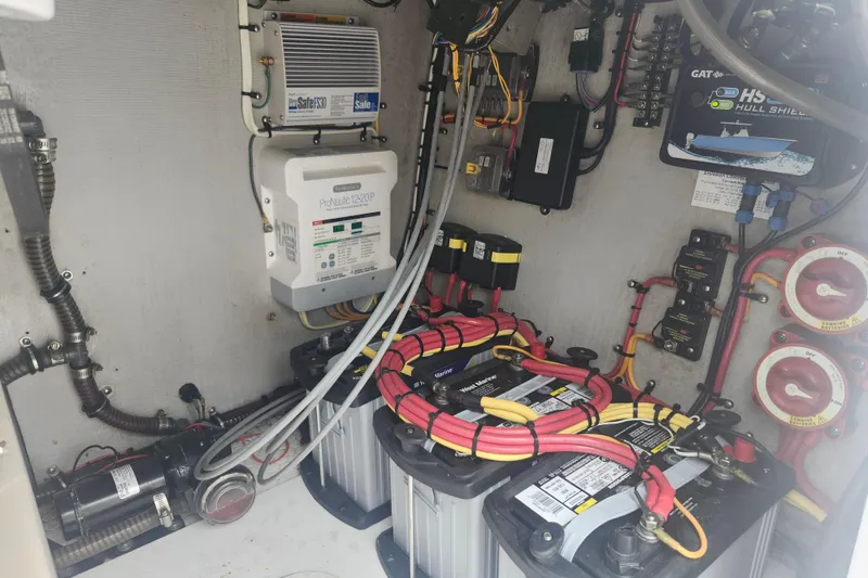 Slide: The Image of Electrical system of a 2014 Concept 30 Cuddy boat, featuring batteries and wiring. - 27