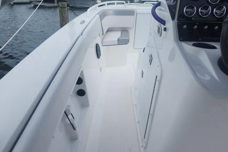 Slide: The Image of 2014 Concept 30 Cuddy boat interior with sleek white design and modern dashboard. - 32