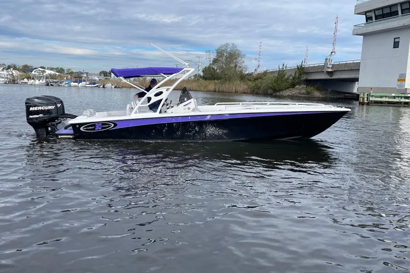 Slide: The Image of 2014 Concept 30 Cuddy boat with Mercury engine on calm water. - 36