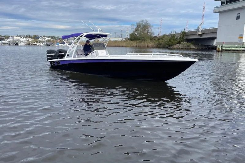 Slide: The Image of 2014 Concept 30 Cuddy boat on calm water near a bridge. - 40