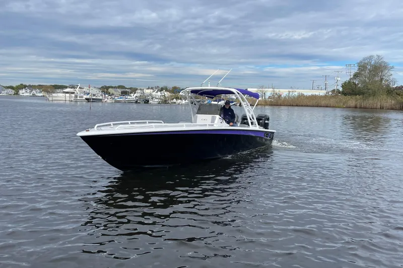 Slide: The Image of 2014 Concept 30 Cuddy boat cruising on a calm river with scenic background. - 43