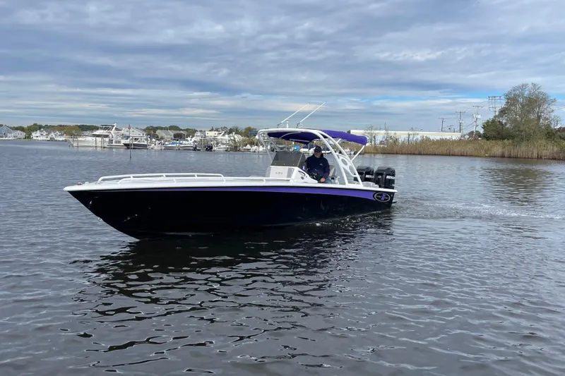 Slide: The Image of 2014 Concept 30 Cuddy boat cruising on a calm river under a cloudy sky. - 44