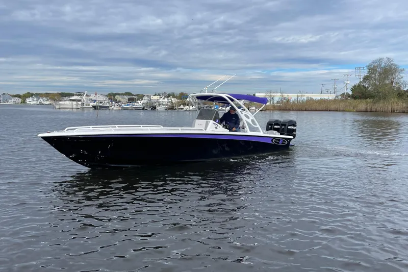 Slide: The Image of 2014 Concept 30 Cuddy boat cruising on a calm river under a cloudy sky. - 45