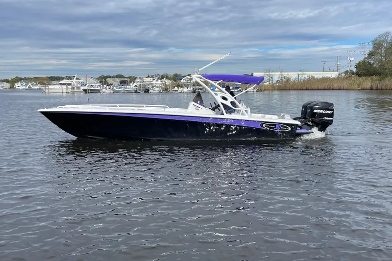 Slide: The Image of 2014 Concept 30 Cuddy boat with Mercury engine on calm water. - 46