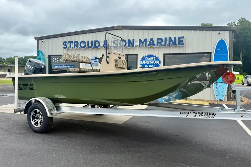 The Image of 2026 Carolina Skiff E18 JVX CC boat on trailer at Stroud & Son Marine. - 1