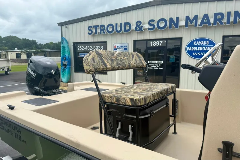 Slide: The Image of 2026 Carolina Skiff E18 JVX CC boat at Stroud & Son Marine dealership. - 20