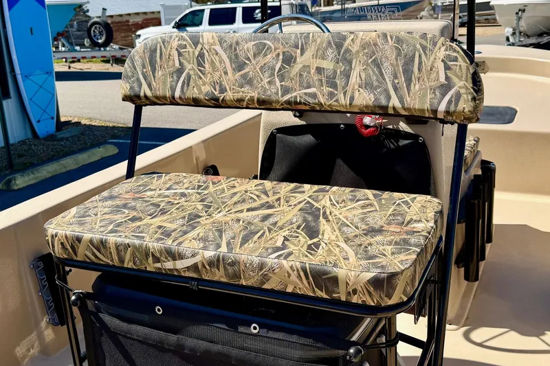 Slide: The Image of 2026 Carolina Skiff E18 JVX CC boat seat with camouflage pattern. - 23