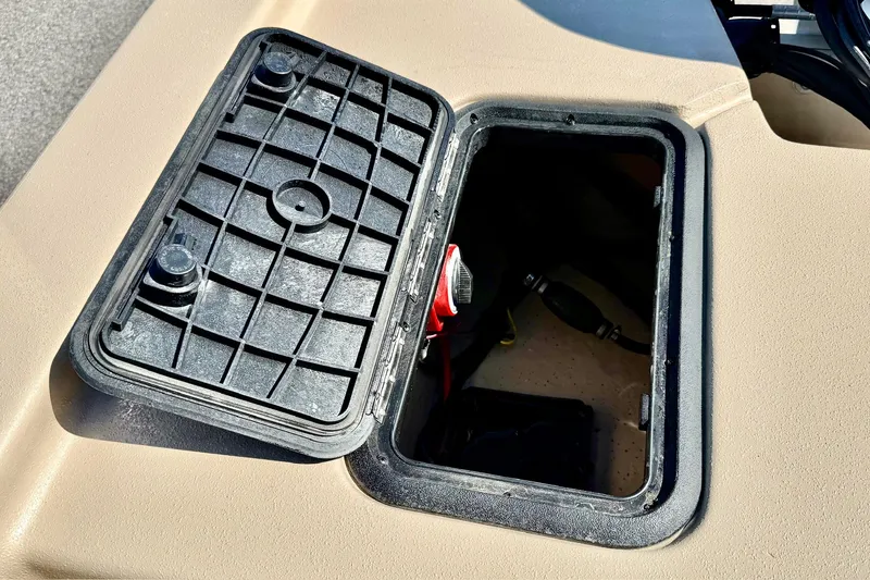 Slide: The Image of Open storage compartment on 2026 Carolina Skiff E18 JVX CC boat. - 26