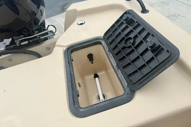 Slide: The Image of Open storage compartment on 2026 Carolina Skiff E18 JVX CC boat. - 27