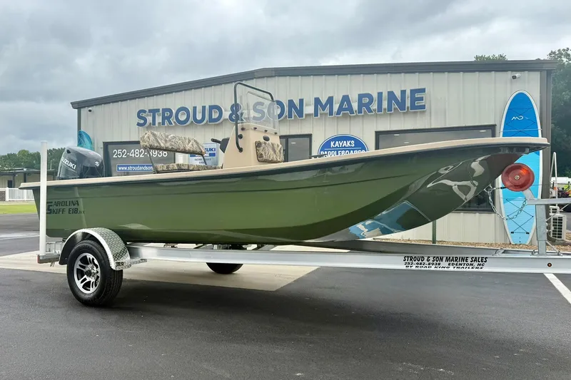 Slide: The Image of 2026 Carolina Skiff E18 JVX CC boat on trailer at Stroud & Son Marine. - 4