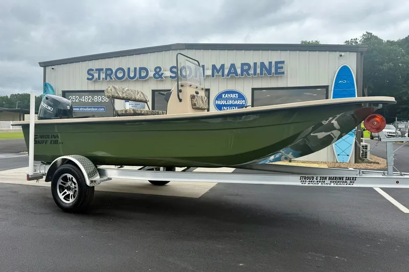Slide: The Image of 2026 Carolina Skiff E18 JVX CC boat on trailer at Stroud & Son Marine. - 6