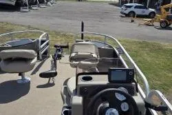 Slide: The Image of 2021 Sun Tracker Bass Buggy 18 DLX pontoon boat with seating and control panel. - 11