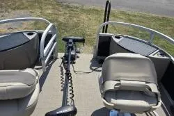 Slide: The Image of 2021 Sun Tracker Bass Buggy 18 DLX pontoon boat interior with seating and motor. - 12