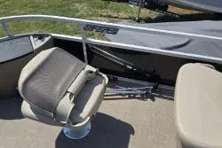 Slide: The Image of 2021 Sun Tracker Bass Buggy 18 DLX boat interior with seating and railing. - 13