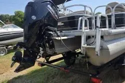 Slide: The Image of 2021 Sun Tracker Bass Buggy 18 DLX pontoon boat with Mercury outboard motor on trailer. - 8