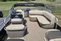 Slide: The Image of 2021 Sun Tracker Bass Buggy 18 DLX pontoon boat with beige seating and canopy. - 9