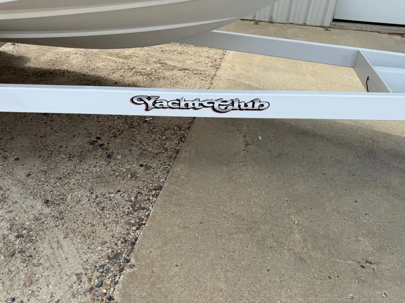 Slide: The Image of Trailer with "Yacht Club" logo for 2014 Cobalt 24SD boat. - 44