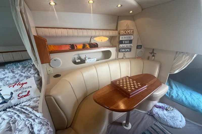 Slide: The Image of Interior of 2001 Cruisers Yachts 2870 Express with cozy seating and chessboard. - 11