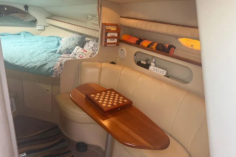 Slide: The Image of Cozy interior of 2001 Cruisers Yachts 2870 Express with seating and chessboard. - 3