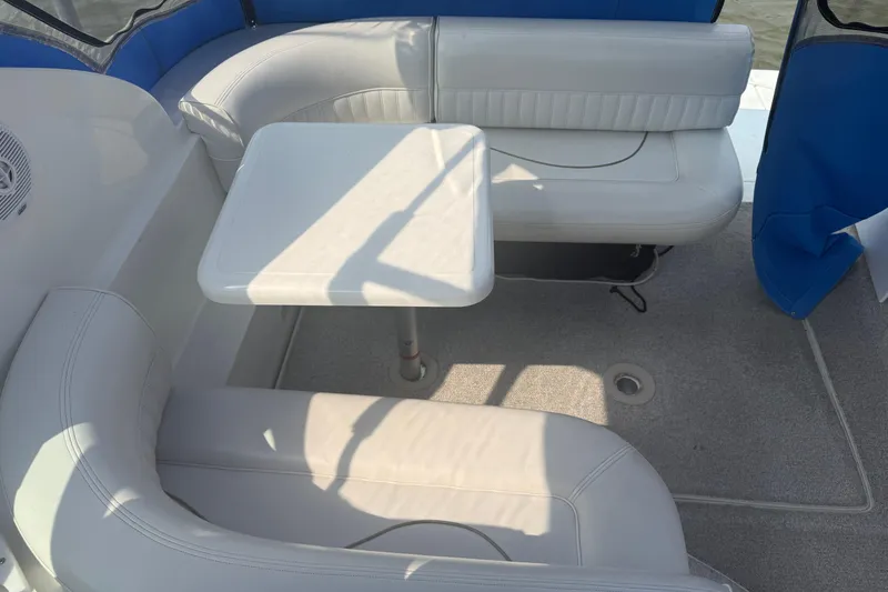 Slide: The Image of 2001 Cruisers Yachts 2870 Express interior with white seating and table. - 4