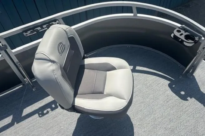 Slide: The Image of 2026 Sun Tracker Bass Buggy 16 XL Select boat seat, gray upholstery, curved railing. - 10